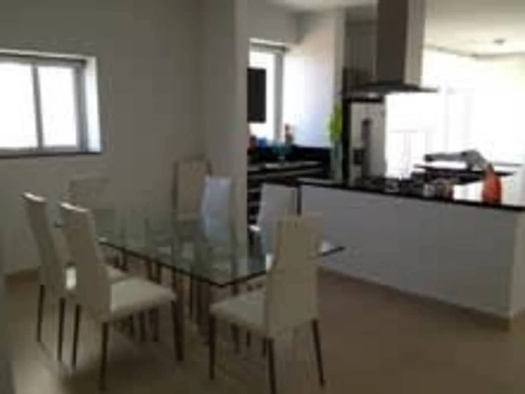 Modern kitchen with granite island, appliances and city view in PH Rivage Tower Panama City