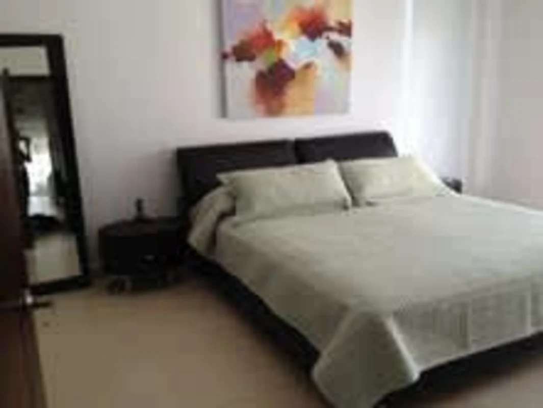 Modern bedroom with large windows and Pacific Ocean view in PH Rivage Tower Panama City