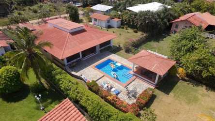 Aerial view of lakefront pool, gardens, and Coronado villa