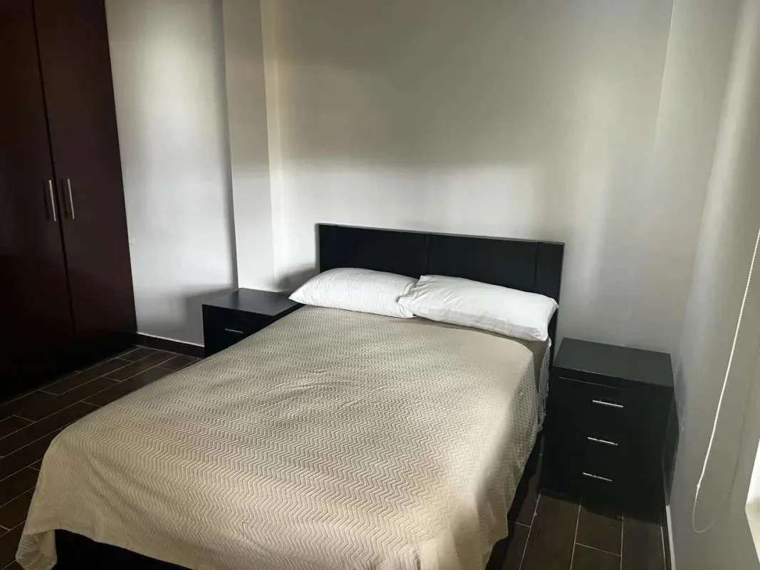 Spacious bedroom with wardrobe and minimalist decor in Los Rios Clayton