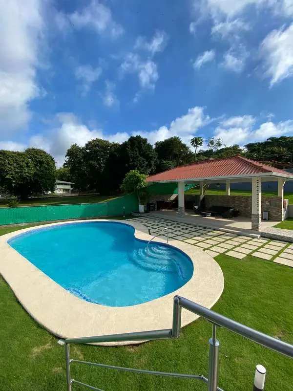 Outdoor private pool with covered patio and garden in Clayton Panama City