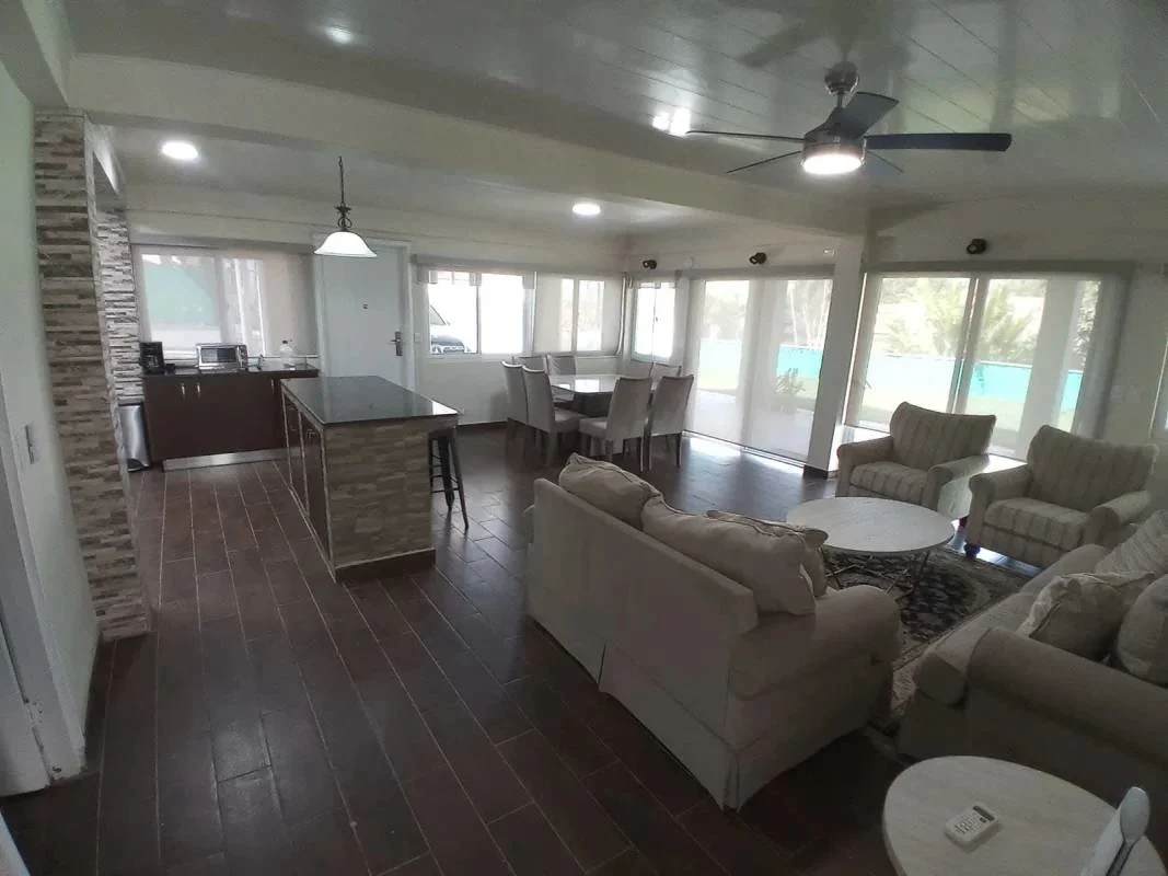Open plan kitchen with island, dining and living area in Clayton Panama rental