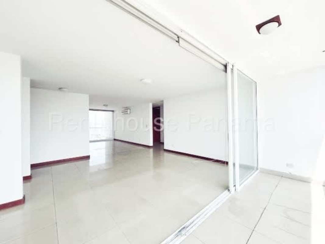 Open living dining space with panoramic windows and ocean view Coco del Mar