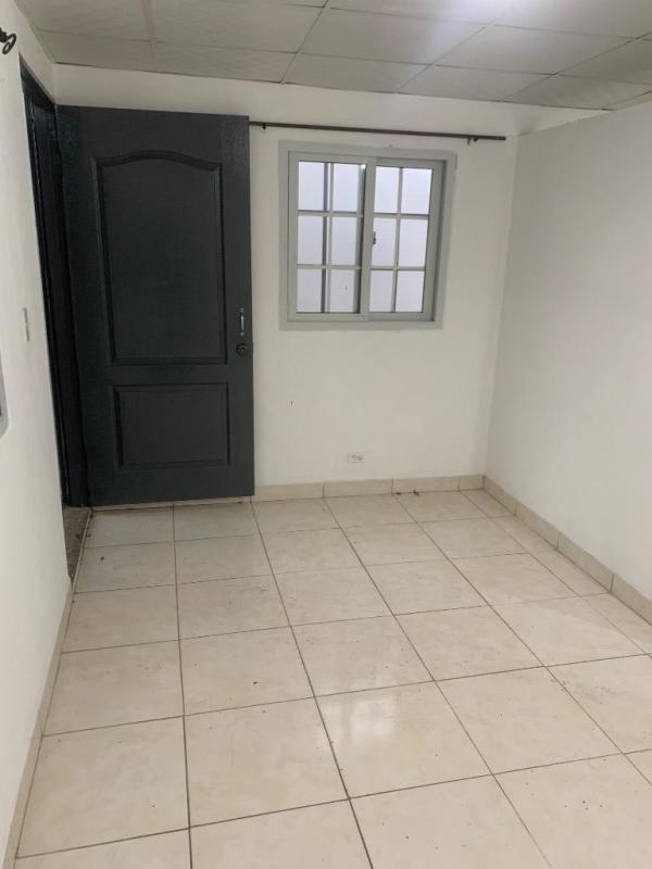 Empty interior room with tiled floor and white walls affordable rental Mateo Iturralde Panama