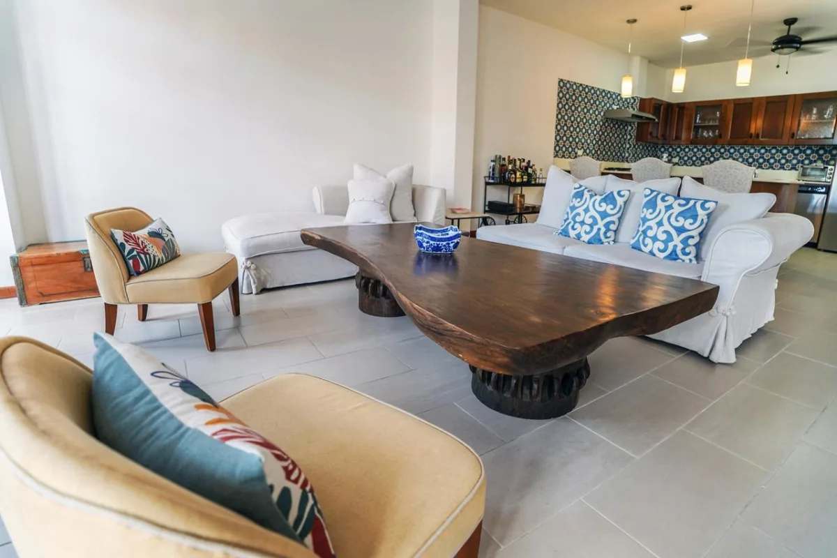 Bathroom with walk-in shower and stone countertop in PH Casco Viejo Residences
