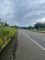Major paved road along large fertile development land in Panama Dolega