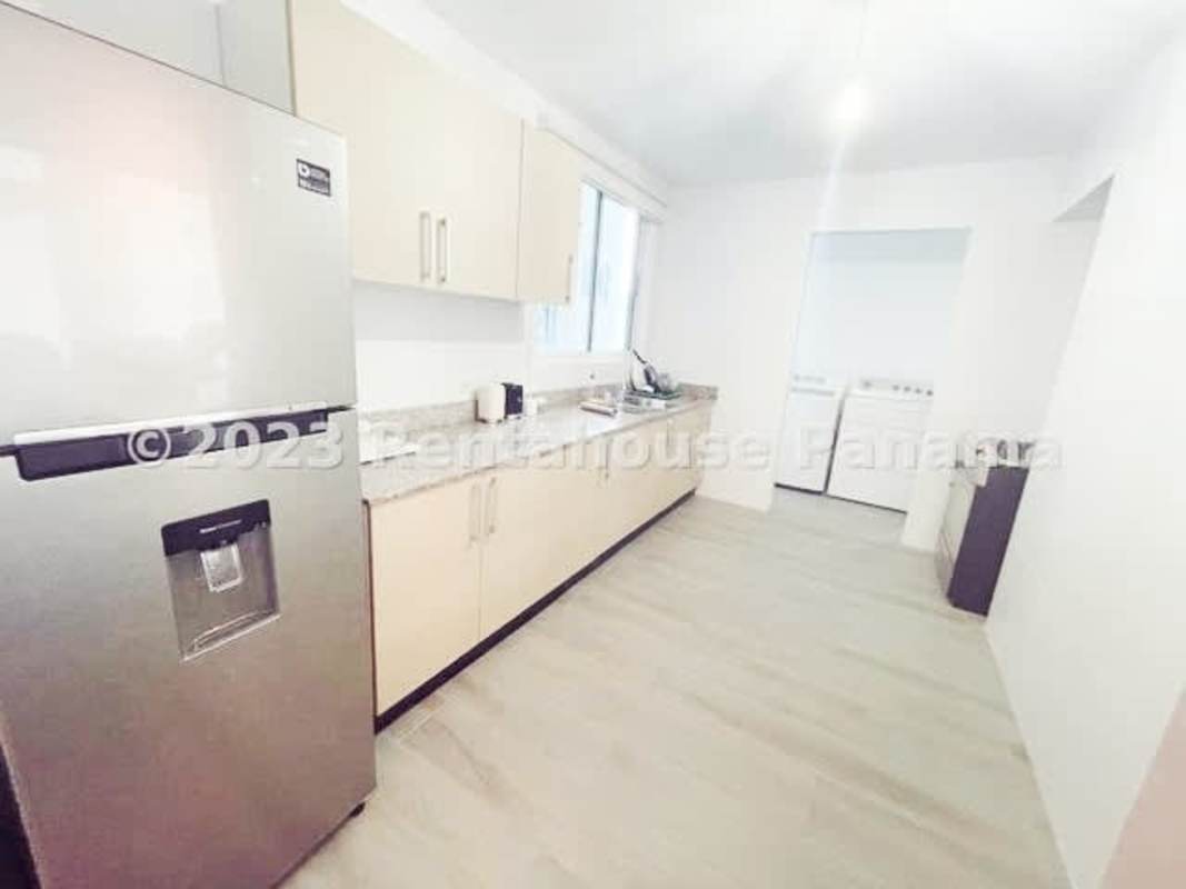 Bright mezzanine bedroom space with wood floors in loft rental apartment Bella Vista Panama