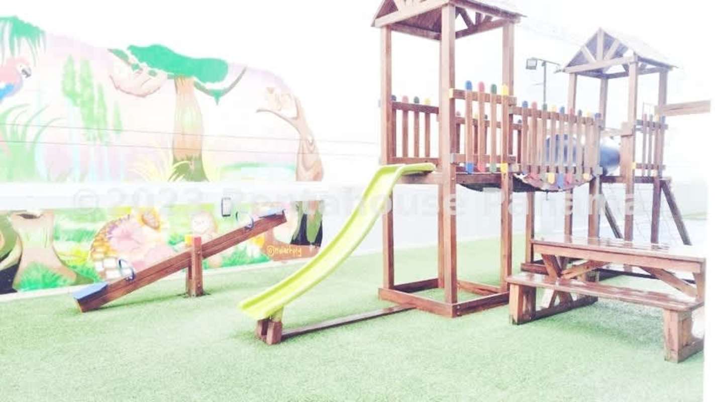 Children's outdoor play area with mural PH Bella Vista Loft Tower Panama City