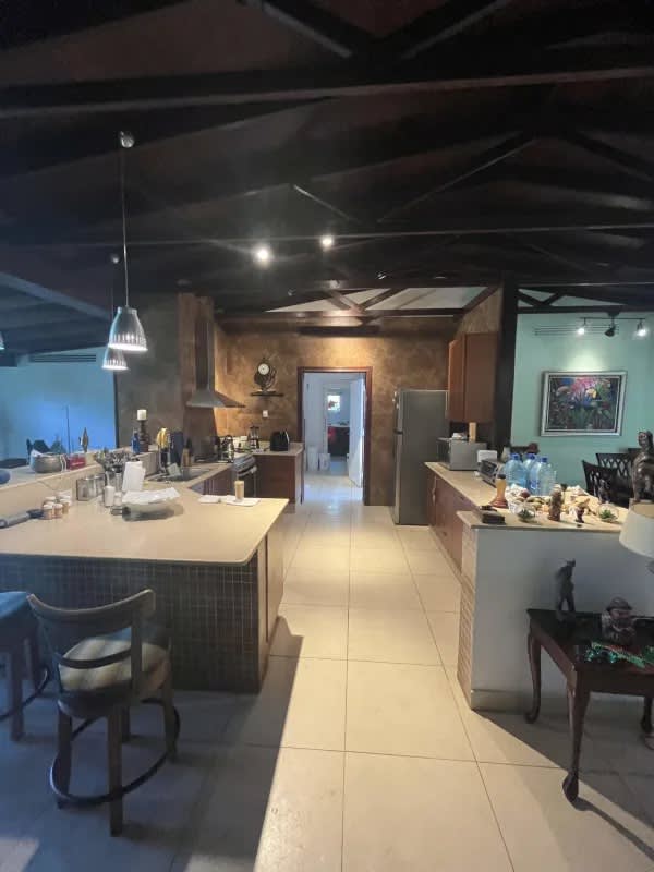 Luxury master bedroom with vaulted wood ceiling garden view Curundu Heights Panama house for sale