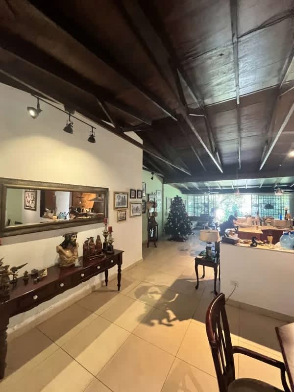Formal dining area exposed wood ceiling bright decor Curundu Heights luxury house Panama