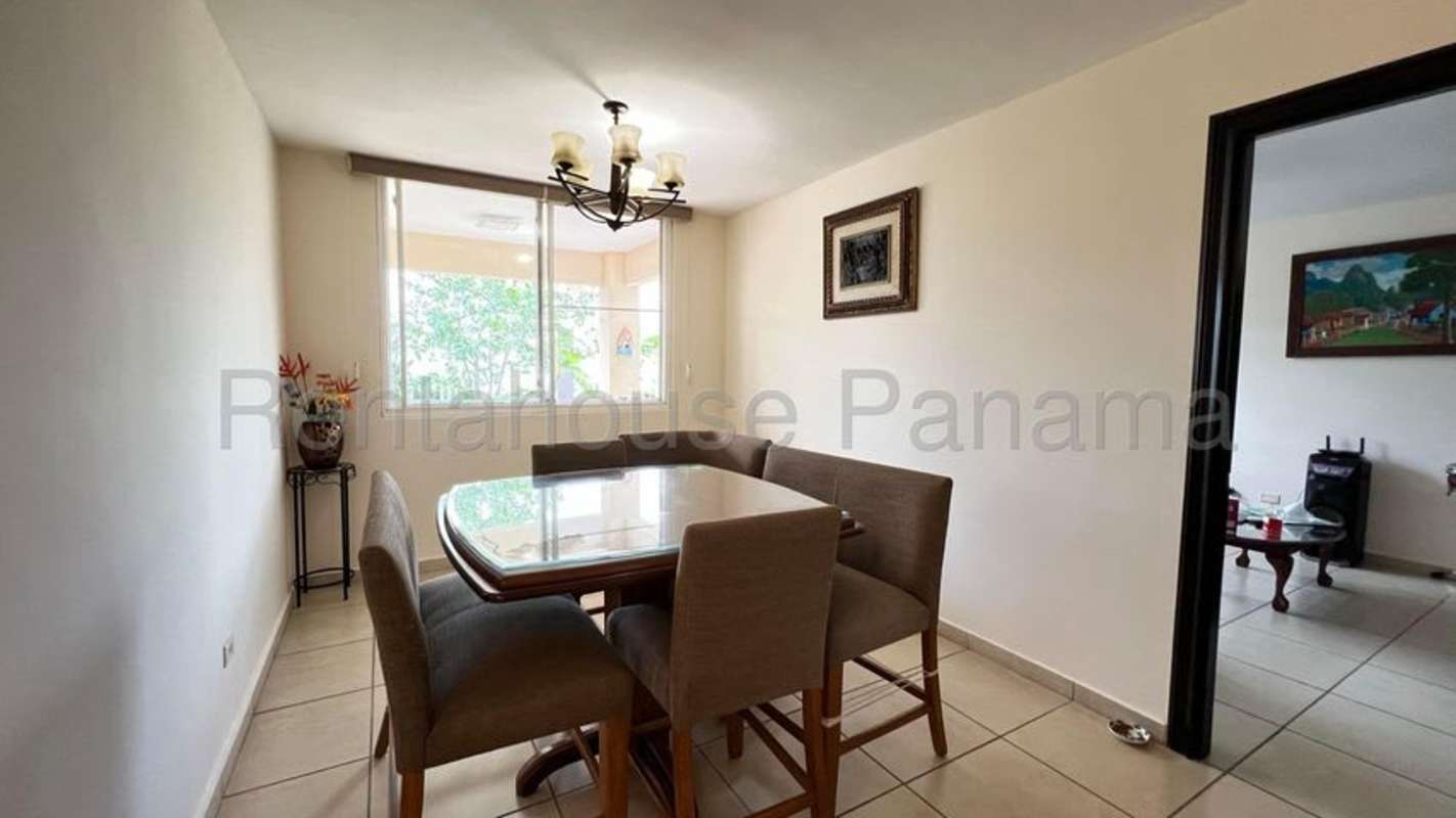 Covered patio terrace with ceiling fans, view of garden in Brisas del Golf Panama City