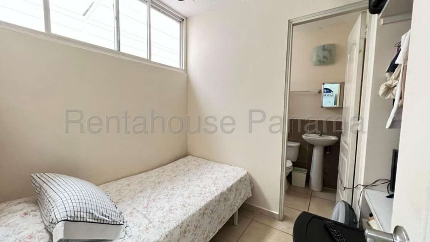 Modern kitchen with granite countertops, ample cabinetry, and appliances in Brisas del Golf Panama City