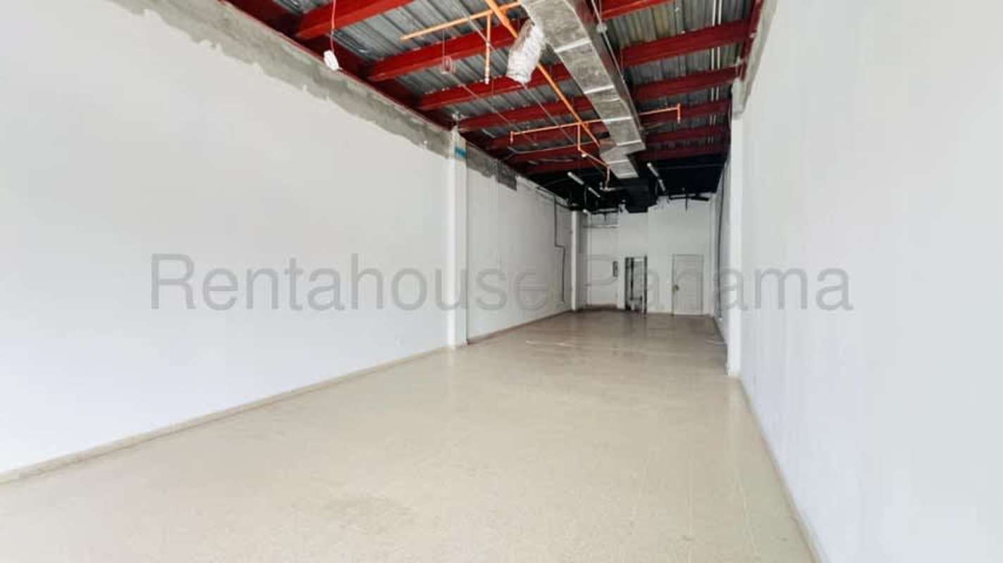 Empty retail unit unfinished exposed wiring concrete tile floors Costa del Este Panama