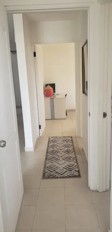 Bright corridor with tile floors and decor in PH Plaza 77 El Cangrejo Panama