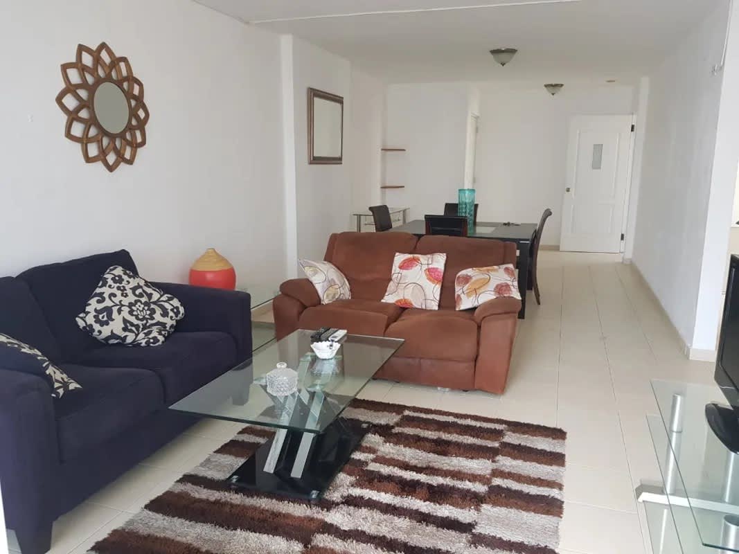 Elegant living area with sofas balcony view modern decor PH Plaza 77 Panama