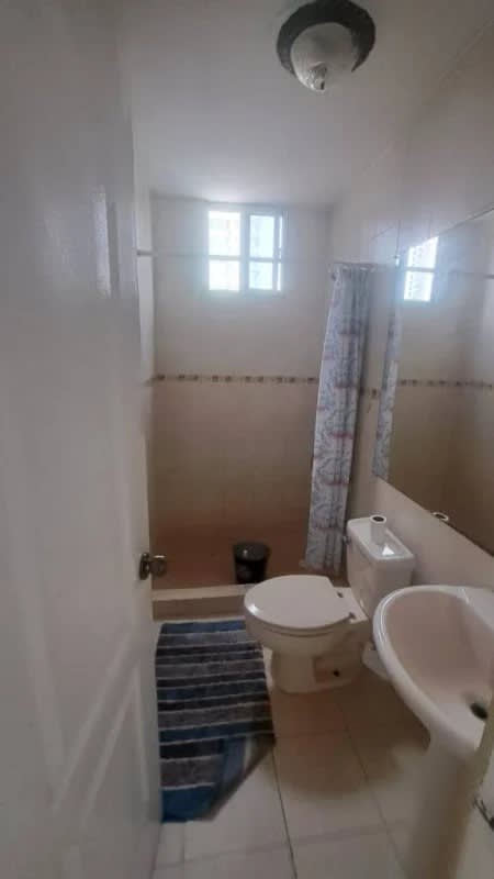 Simple bathroom with walk-in shower, tile, and window PH Plaza 77 El Cangrejo Panama