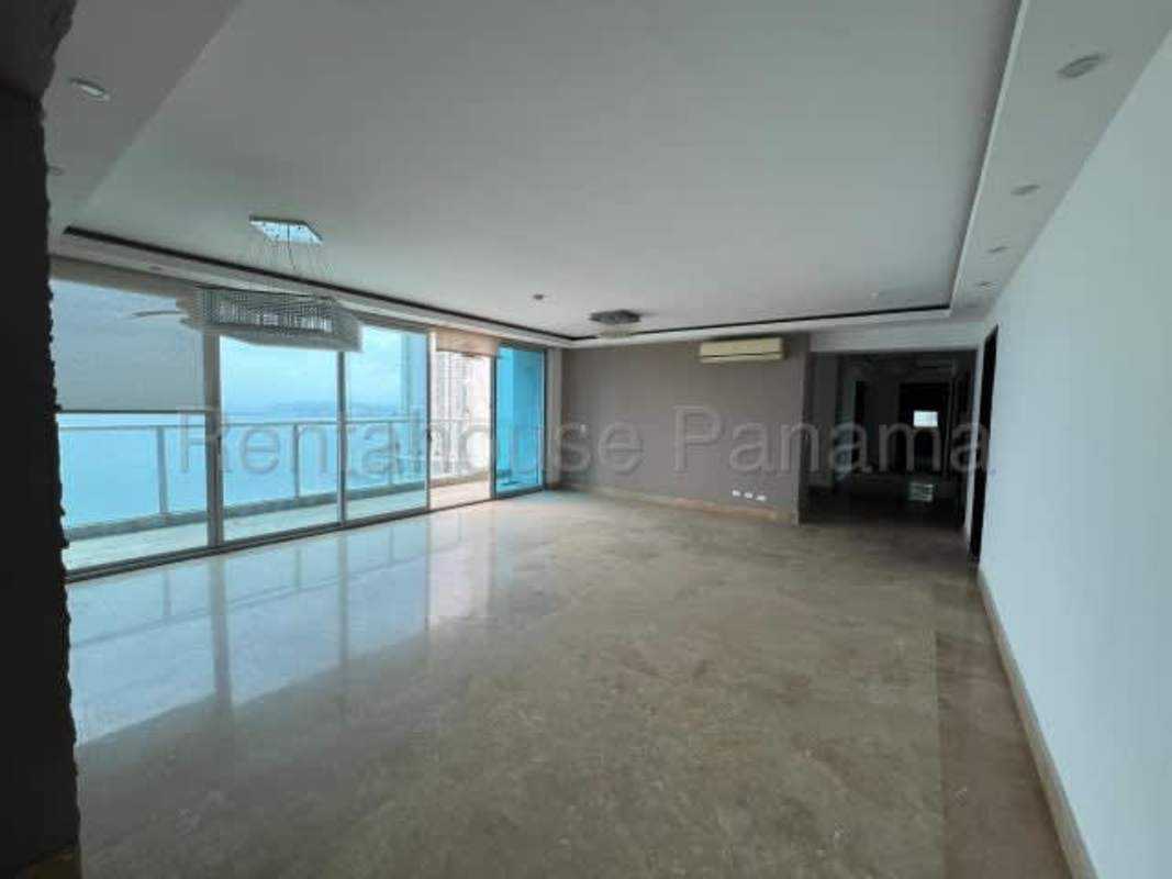 Large bedroom with marble floors and huge windows overlooking Panama Bay in PH Ocean Club