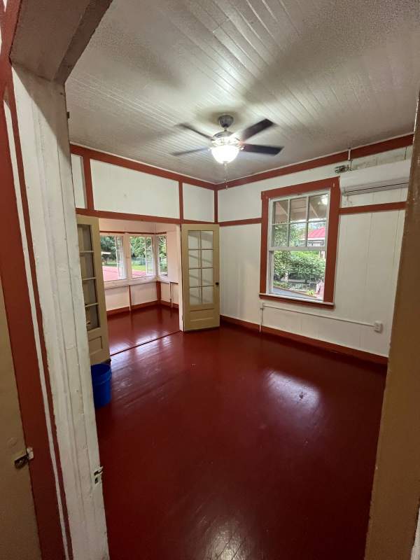 Empty bedroom with split air conditioner, window, closet area in apartment rental Clayton Balboa Panama