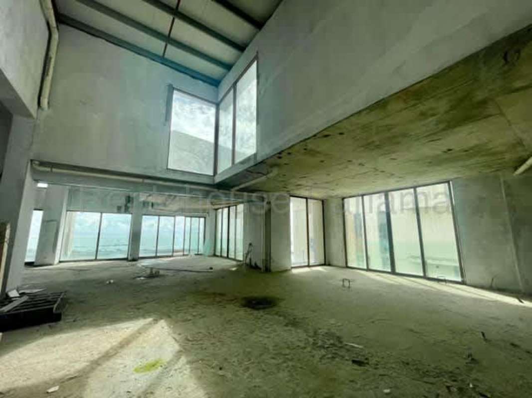 Spacious double-height open living room in luxury Punta Pacífica Ocean Reef Islands penthouse Panama