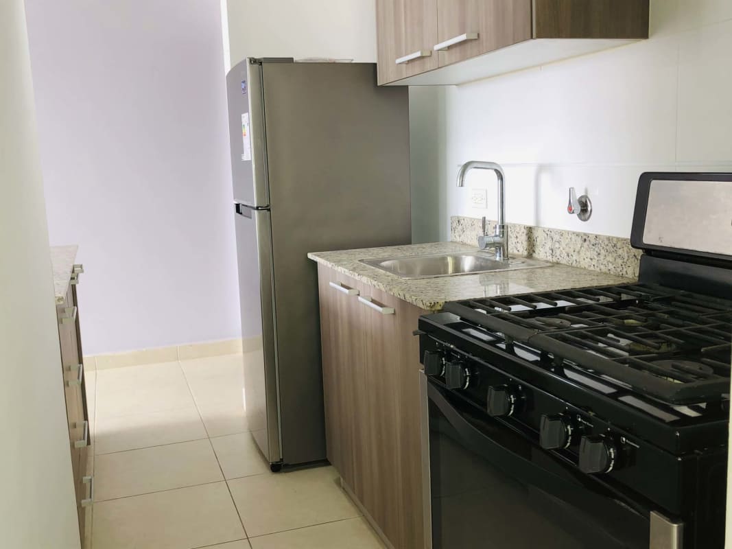 Outdoor playground with gazebo, green lawn and mountain backdrop at PH Villa Zaita Panama