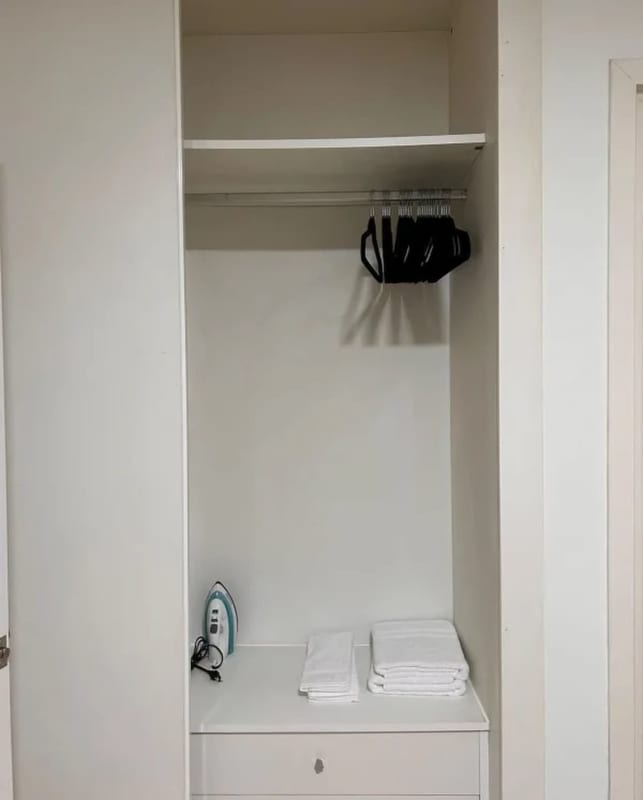 Round white dining table with neutral decor minimalist apartment Panama