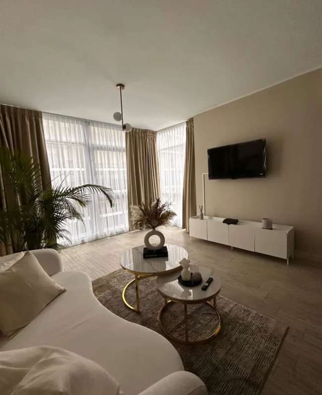 Minimalist built-in closet space with ironing facility and storage in apartment San Francisco Panama