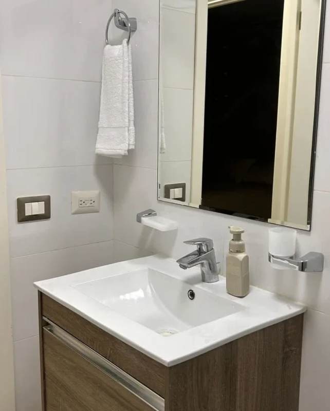 Modern bathroom with vanity sink and glass shower PH Titanium Tower Panama City