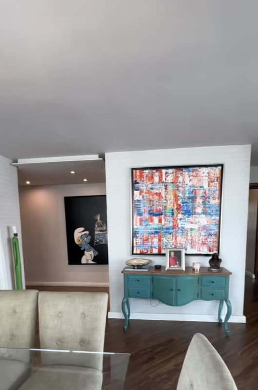 Dining room with wall art modern lighting PH Titanium Tower apartment in San Francisco Panama