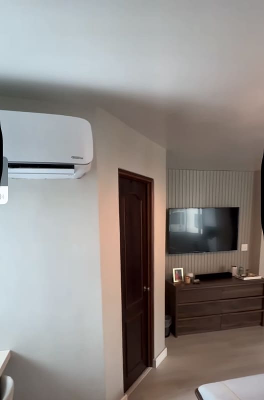 Bedroom with chandelier workspace blinds PH Titanium Tower San Francisco Panama