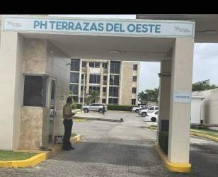 Entrance with security booth and apartment buildings at PH Terrazas del Oeste La Chorrera Panama