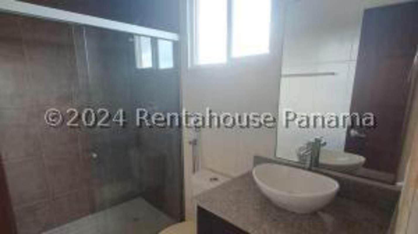 Large outdoor swimming pool amid landscaped greenery Villa Alta Brisas del Golf Panama