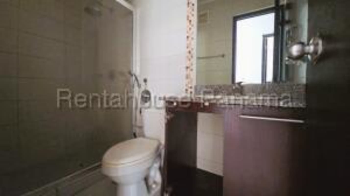 Modern bathroom with glass shower, granite vanity PH Lefevre 75 apartment Panama