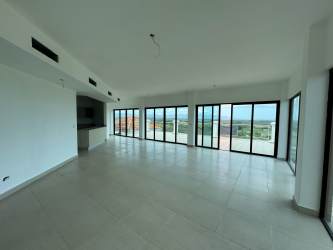 Spacious living room with panoramic sea and golf course views in Vista Mar penthouse San Carlos Panama