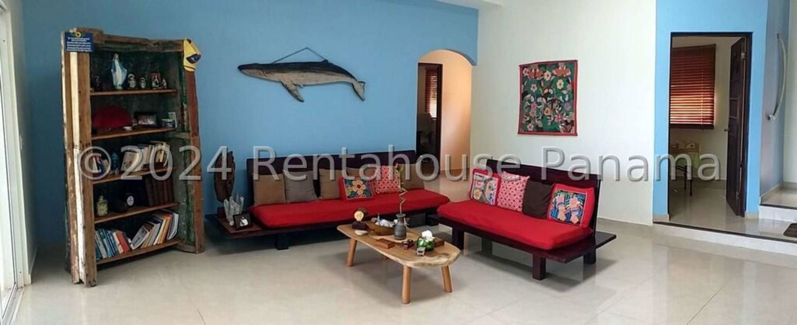 Bright villa with orange facade, wrap-around terrace and beachfront gardens on Isla Saboga Panama