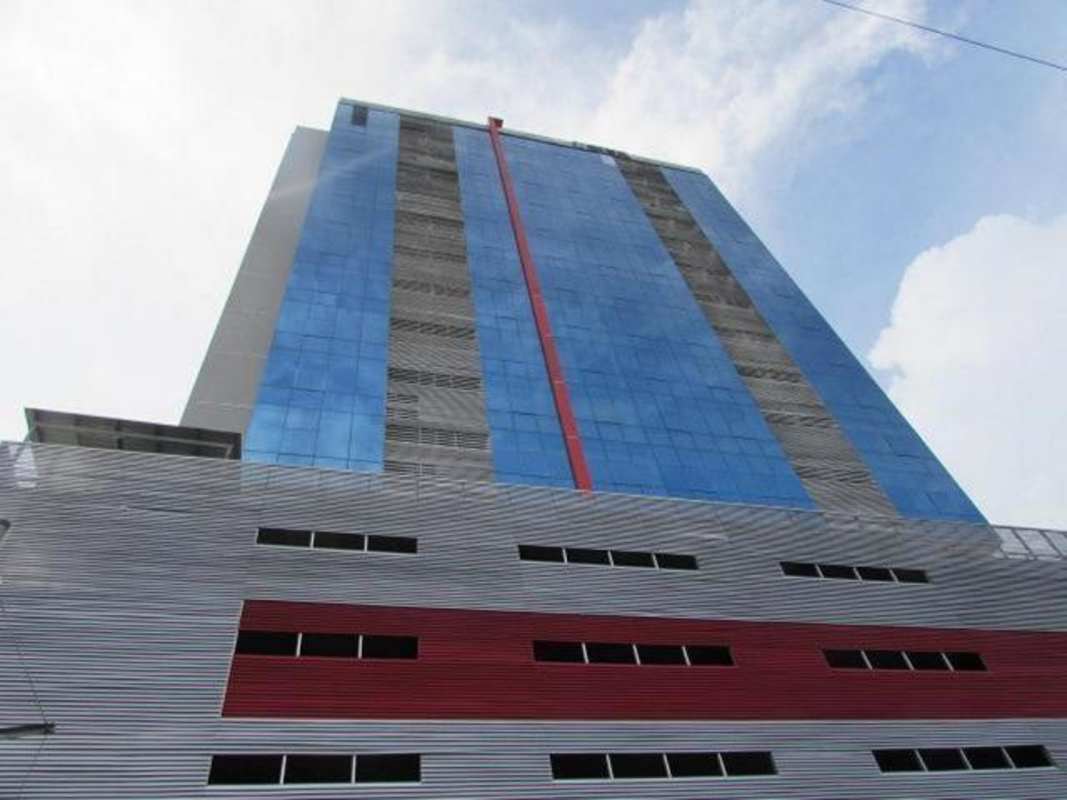 Modern commercial office tower with glass facade Obarrio financial district Panama City