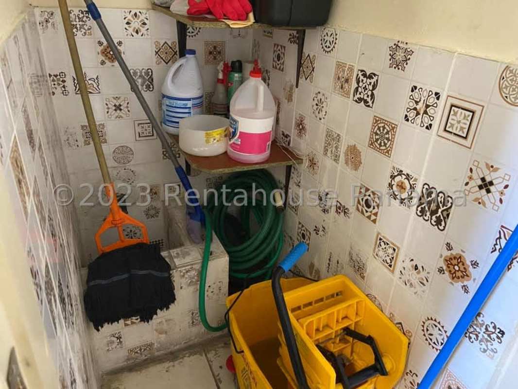 Utility cleaning room with sink and utility storage inside commercial rental Panama