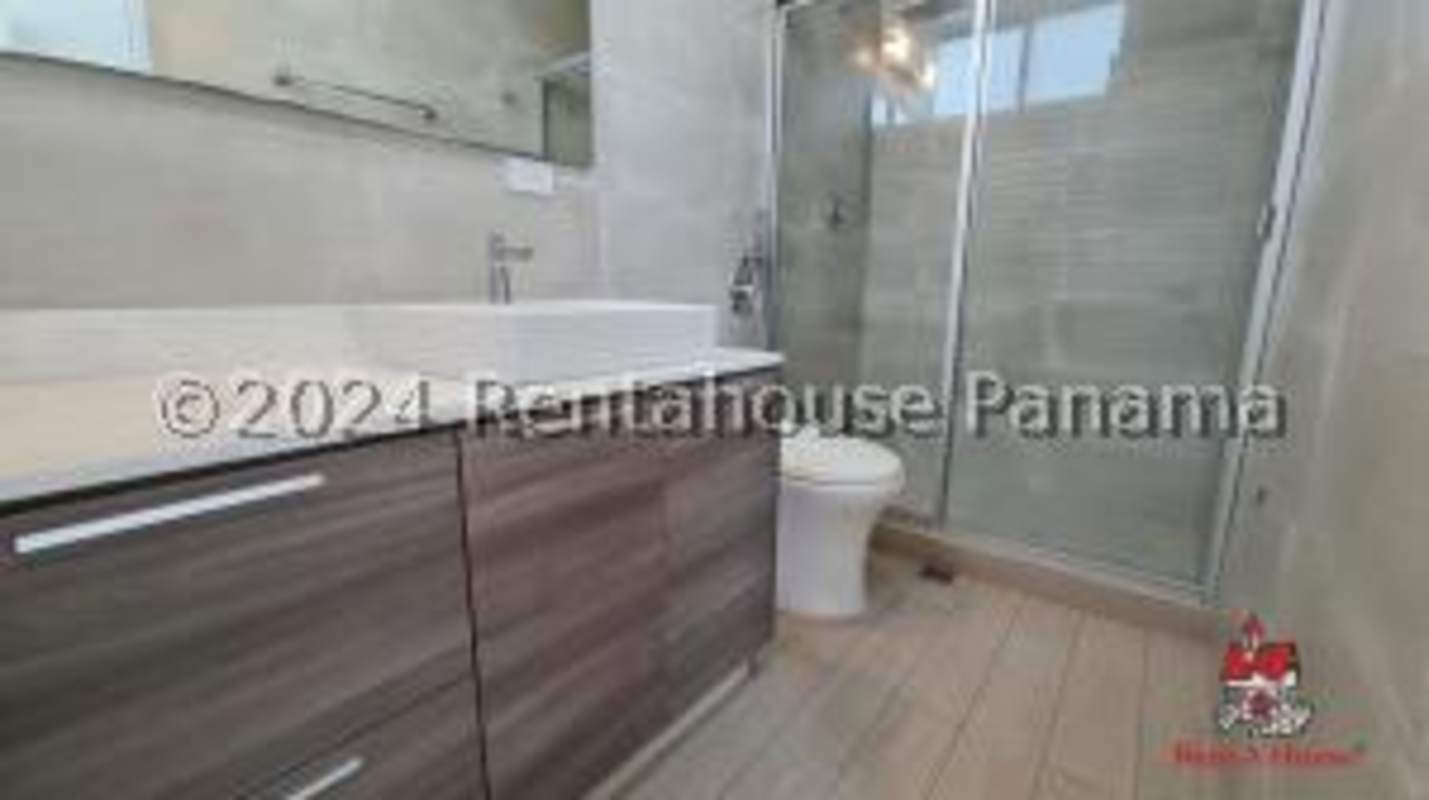 Modern bathroom granite vanity glass shower PH Sol del Este apartment Costa del Este Panama