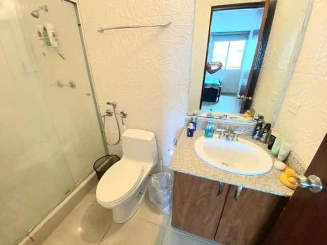 Covered playground area and outdoor swimming pool in PH The Quadrant Panama City