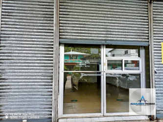 Storefront with metal rolling shutter and glass entry doors Bugaba Chiriqui