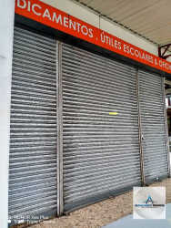 Street view of commercial retail space with metal rolling security door in Bugaba Chiriquí Panama
