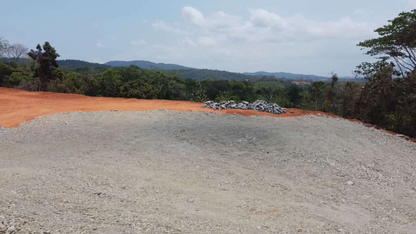 Cleared land with gravel and mountain background in Calzada Larga Panama