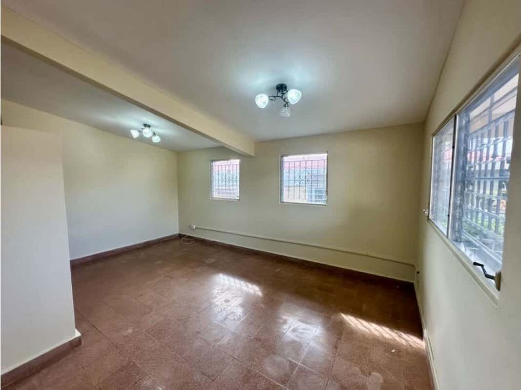 Spacious empty living dining room tile flooring large windows Chanis home rental Panama