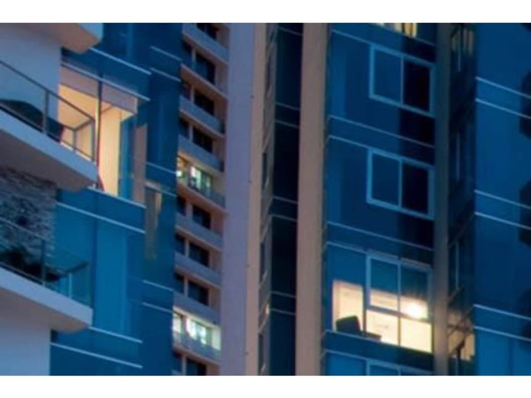 Bright living room with floor-to-ceiling windows and ocean view in Pacific Village Panama