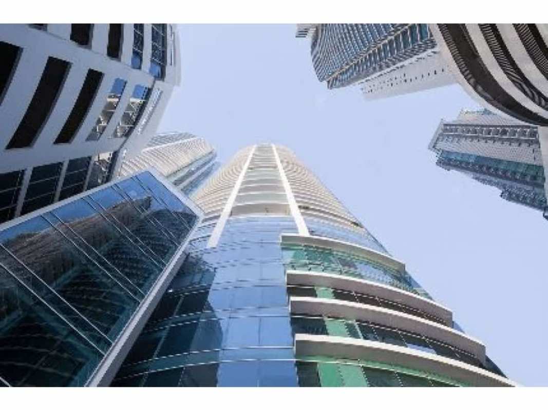 Modern fitness center with cardio equipment and weights at PH Pacific Village in Panama City