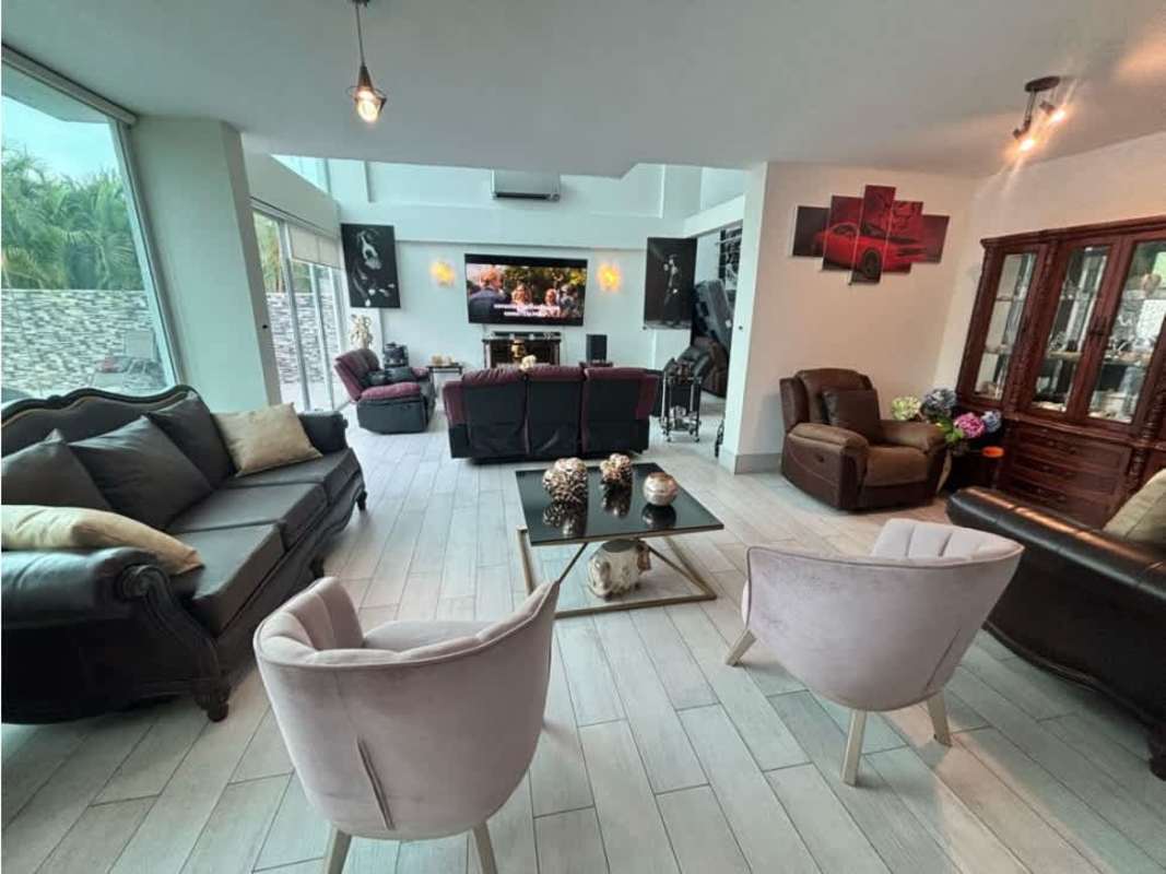 Large bedroom with garden and pool view, luxury finishes in Costa Esmeralda Panama