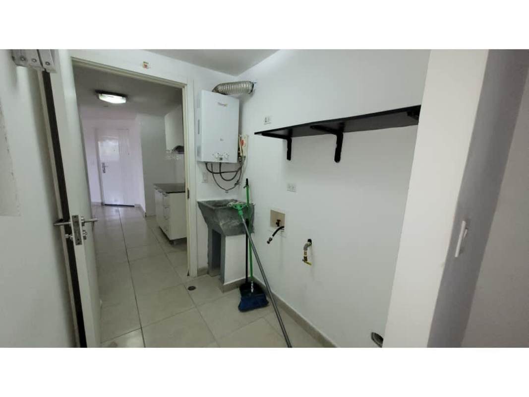 Modern bathroom with glass shower enclosure and mosaic tile accent