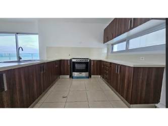 Luxury bedroom with balcony access and ocean skyline views at PH Oasis Punta Pacífica Panama