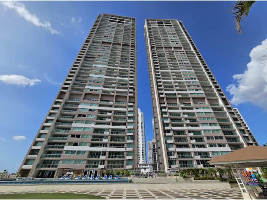 Spacious modern kitchen with wood cabinets granite countertops and ocean skyline views at PH Sevilla Costa del Este Panama