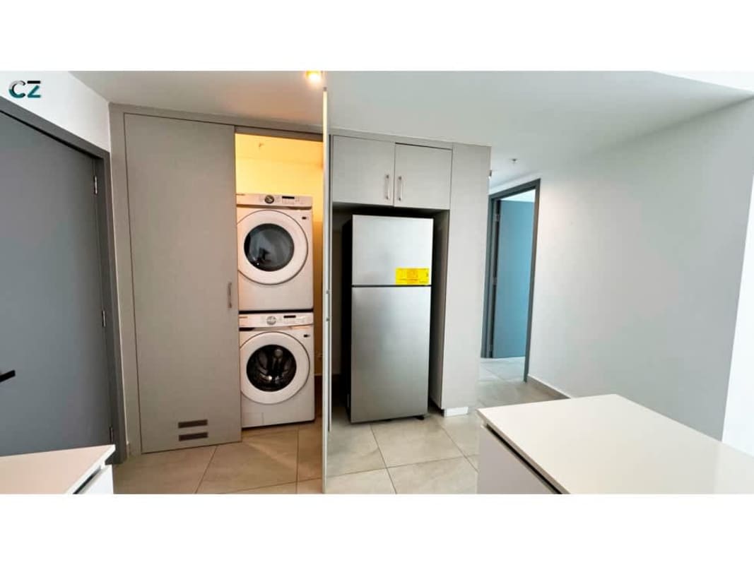 Laundry space inside kitchen with stacked washer dryer setup PH Van Gogh Panama City