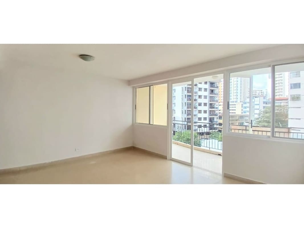White minimalist kitchen with brick accent wall and tile backsplash PH Edificio Rattan El Cangrejo Panama City